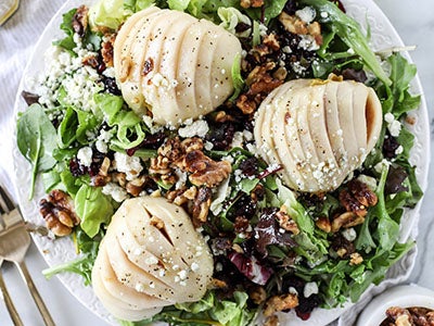 chardonnay poached pear salad on plate
